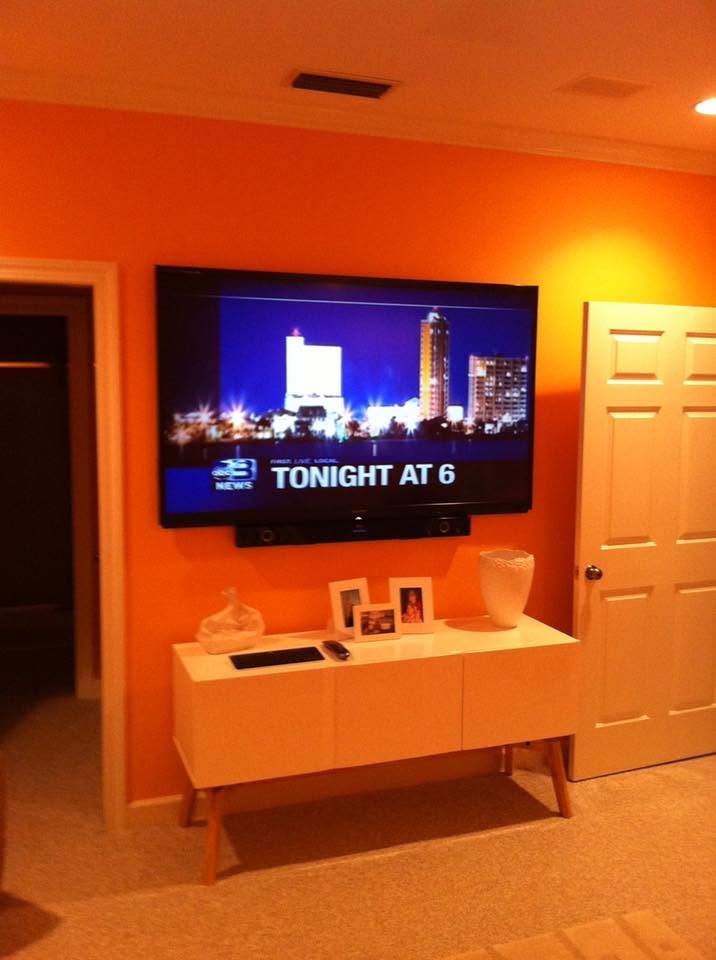 Home theater with wall-mounted TV